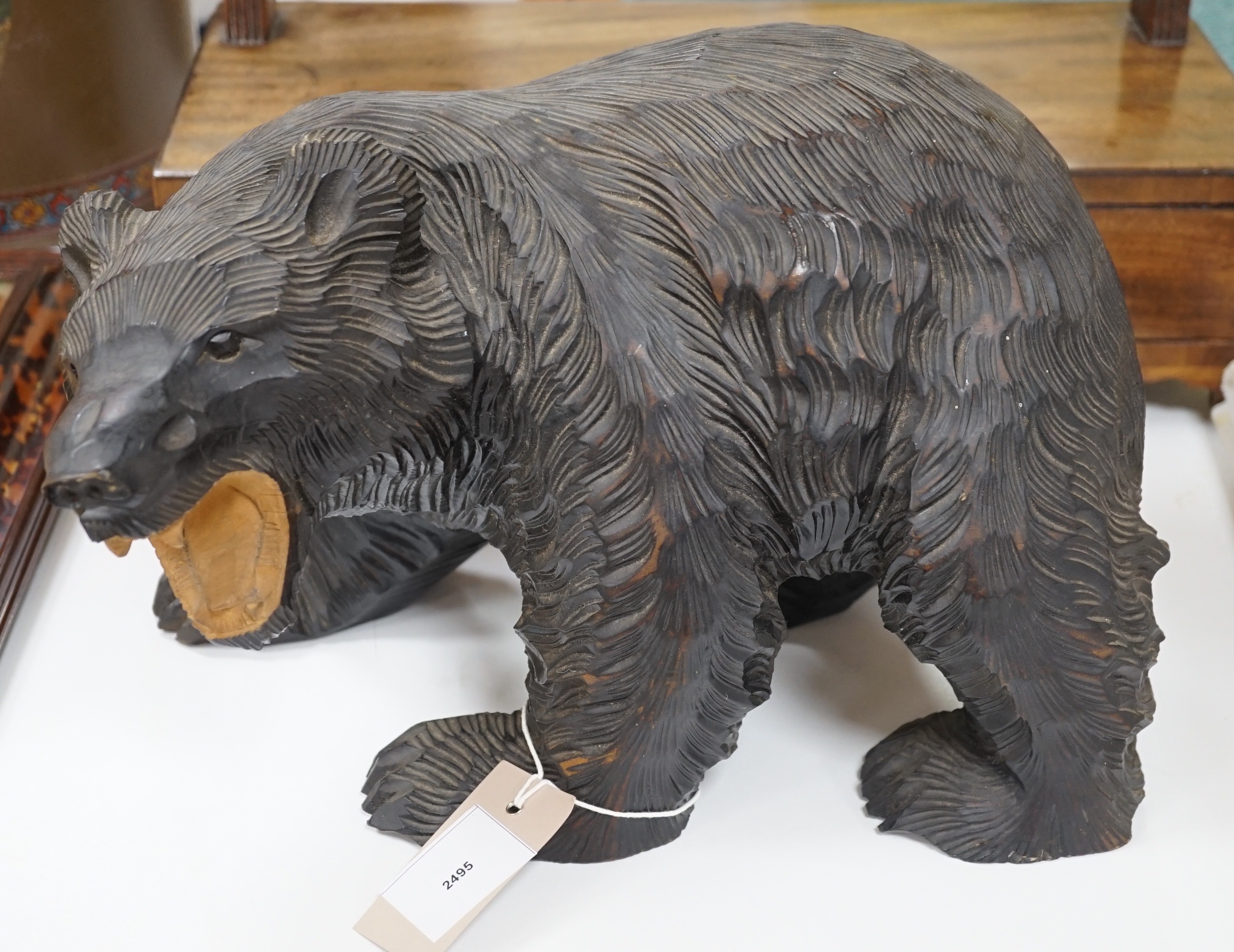 A Japanese carved wood bear, 35 cms wide